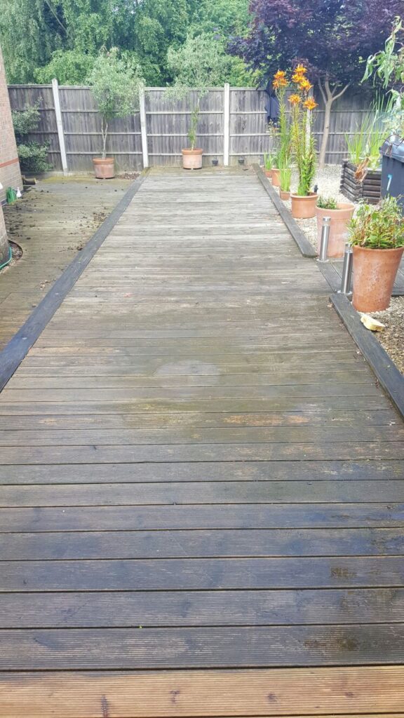 Dirty, tired, garden decking in Sheffield.